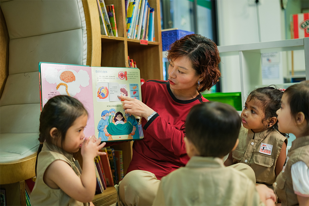 Teacher reading to children